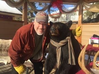 Michel Miserany  posing with a stuffed bear