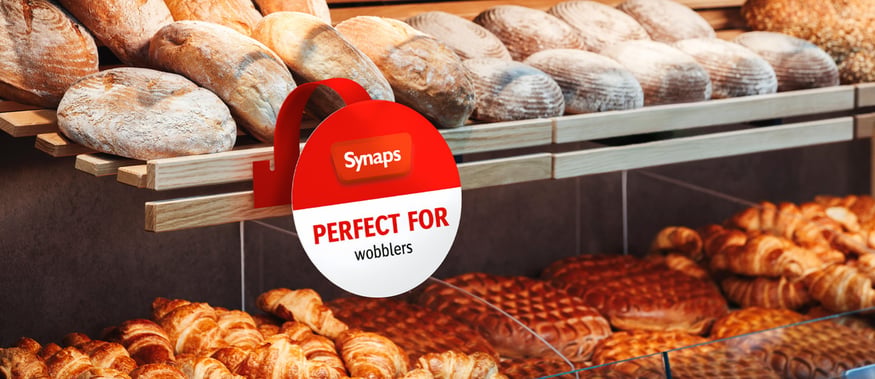 SYNAPS synthetic paper used as a shelf wobbler for loaves of bread in a grocery store